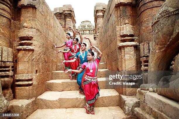 odissi dancers striking a pose - indian dance stock pictures, royalty-free photos & images