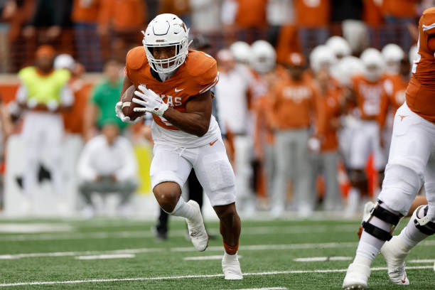 Bijan Robinson of the Texas Longhorns rushes for a touchdown in the first half against the Baylor Bears at Darrell K Royal-Texas Memorial Stadium