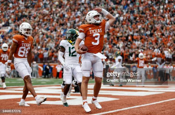 Quinn Ewers of the Texas Longhorns reacts after rushing for a touchdown in the first half against the Baylor Bears at Darrell K Royal-Texas Memorial...