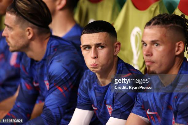 Phil Foden of England reacts in the dugout prior to the FIFA World Cup Qatar 2022 Group B match between England and USA at Al Bayt Stadium on...