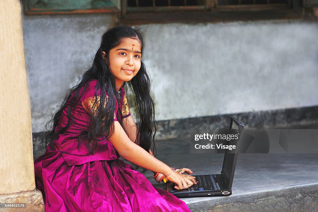 Portrait of a girl with laptop