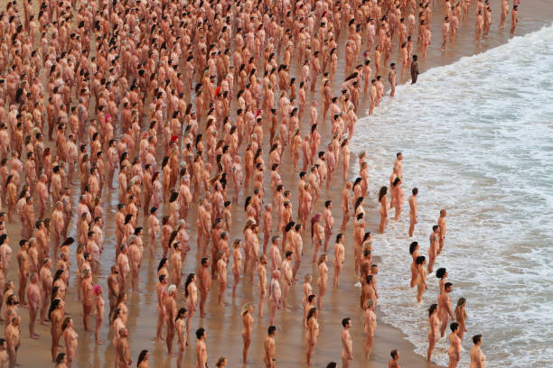 AUS: Thousands Of Sydneysiders Pose Nude For Spencer Tunick Installation On Bondi Beach