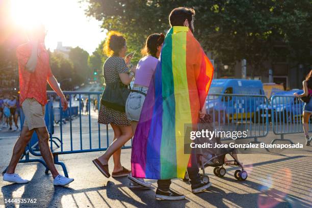 family walking in the celebration of the gay pride parade in madrid - marcha do orgulho gay imagens e fotografias de stock