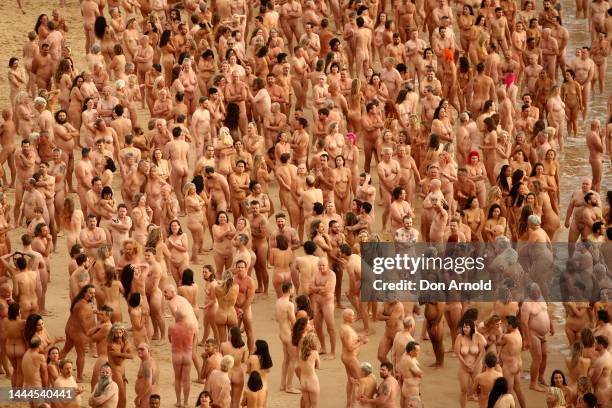 Members of the public pose at Bondi Beach on November 26, 2022 in Sydney, Australia. US artist and photographer Spencer Tunick created the nude...