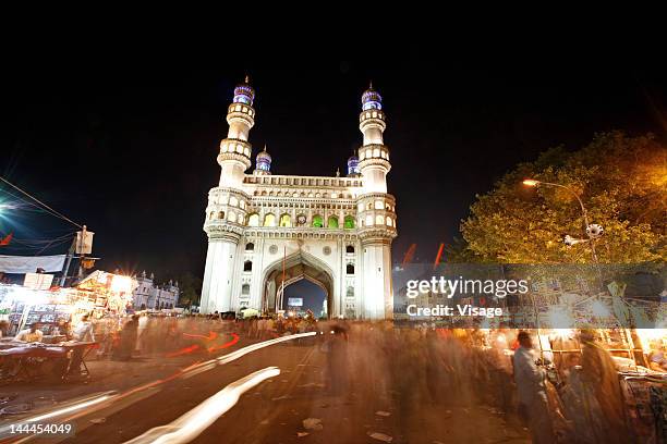 low angle view of charminar at night - charminar stock pictures, royalty-free photos & images