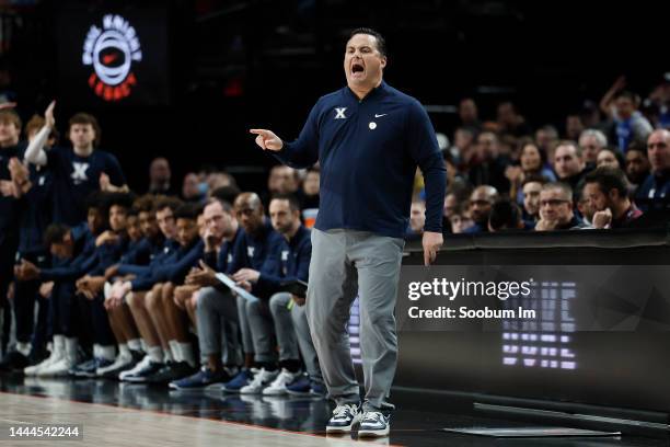 Head coach Sean Miller of the Xavier Musketeers gives direction to his team during the first half against the Duke Blue Devils at Moda Center on...