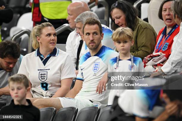 Harry Kane of England interacts with their partner Katie Goodland after the 0-0 draw during the FIFA World Cup Qatar 2022 Group B match between...