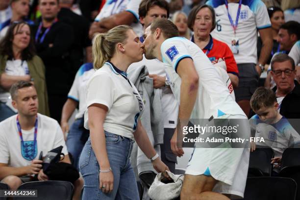 Harry Kane of England kisses their partner Katie Goodland after the 0-0 draw during the FIFA World Cup Qatar 2022 Group B match between England and...