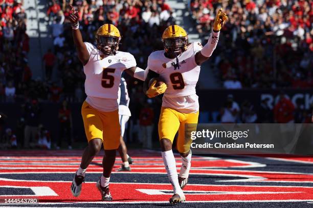 Defensive back Ro Torrence of the Arizona State Sun Devils celebrates with Chris Edmonds after Torrence intercepted a pass from the Arizona Wildcats...