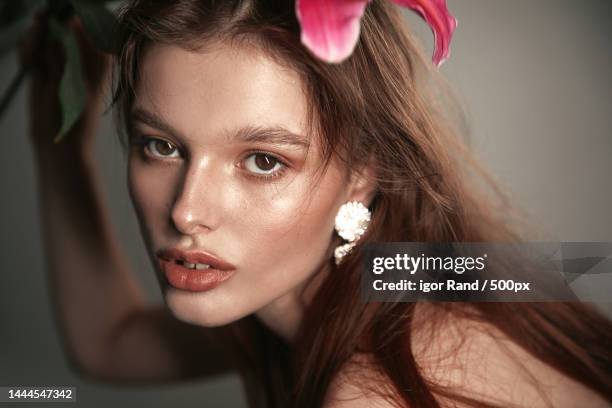 close-up portrait of beautiful young woman wearing make-up against wall,china - chinese fashion designer stock pictures, royalty-free photos & images
