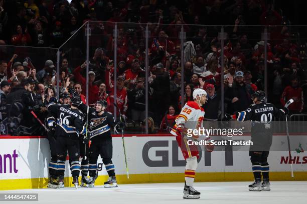 Alex Ovechkin of the Washington Capitals celebrates with teammates after scoring a goal against the Calgary Flames during the third period of the...