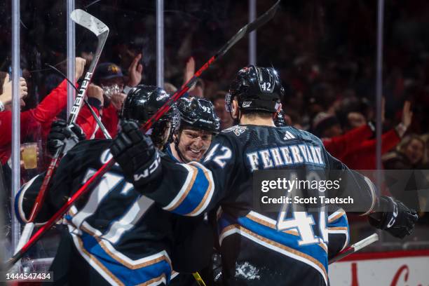 Evgeny Kuznetsov of the Washington Capitals celebrates with teammates after scoring a goal against the Calgary Flames during the second period of the...