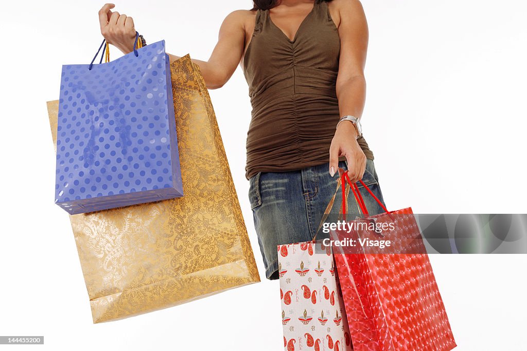 Young woman holding shopping bags