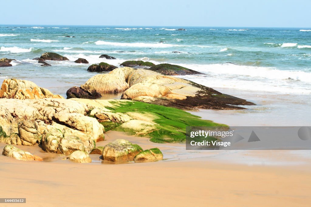 Waves hitting rock at a beach