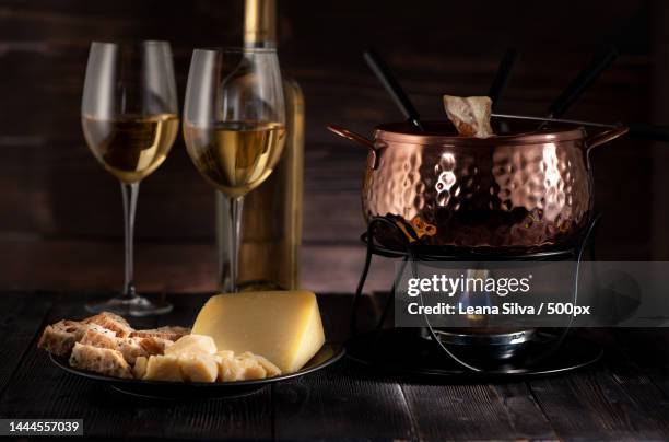 close-up of wine and wine on table,united states,usa - fondue stock-fotos und bilder