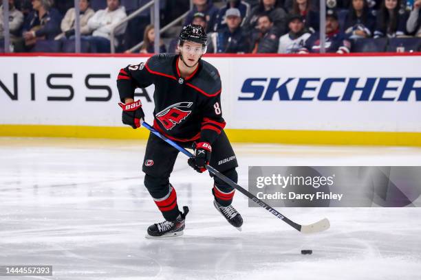 Jesperi Kotkaniemi of the Carolina Hurricanes plays the puck up the ice during second period action against the Winnipeg Jets at the Canada Life...