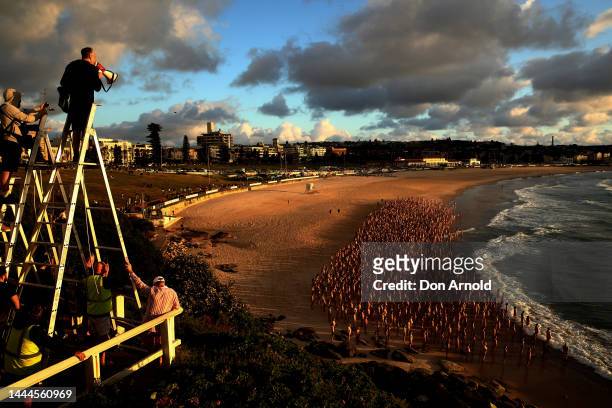 Spencer Tunick is seen photographing members of the public posing at Bondi Beach on November 26, 2022 in Sydney, Australia. US artist and...