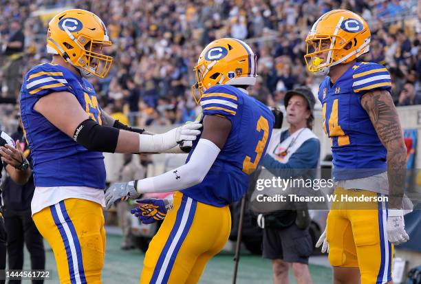 Jeremiah Hunter, Monroe Young and Ben Coleman of the California Golden Bears celebrates after Hunter caught his second touchdown of the second...