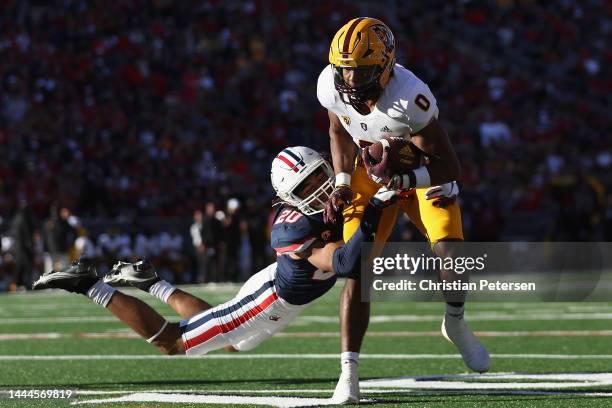 Wide receiver Charles Hall IV of the Arizona State Sun Devils makes a reception against cornerback Treydan Stukes of the Arizona Wildcats during the...