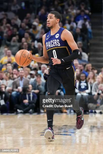 Tyrese Haliburton of the Indiana Pacers dribbles the ball in the second quarter against the Minnesota Timberwolves at Gainbridge Fieldhouse on...