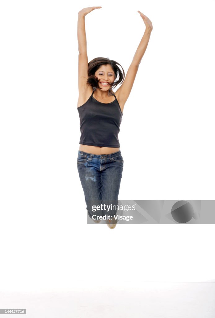 Young woman jumping with excitement