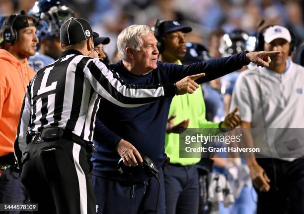 Head coach Mack Brown of the North Carolina Tar Heels argues with an official during their game against the North Carolina State Wolfpack at Kenan...