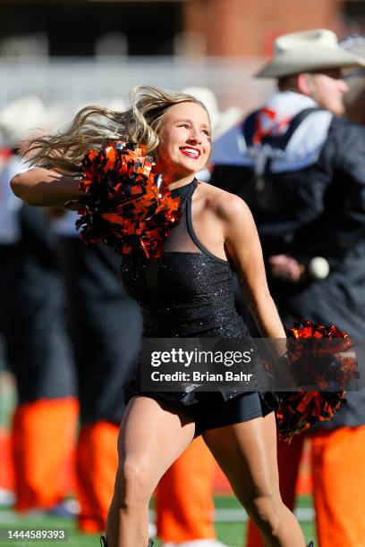 Member of the Oklahoma State Cowboys pom squad cheers before a game against the Iowa State Cyclones at Boone Pickens Stadium on November 12, 2022 in...