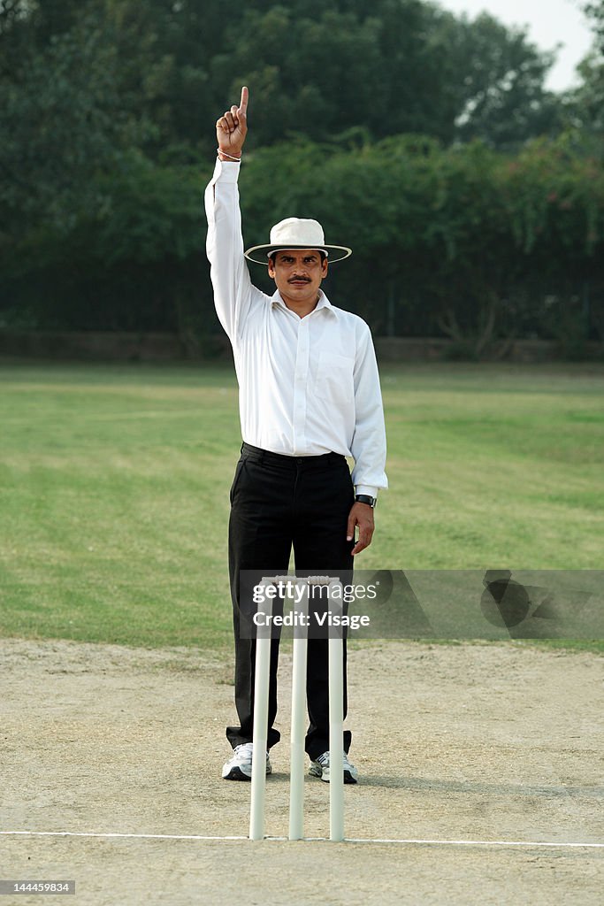 Cricket umpire signaling out