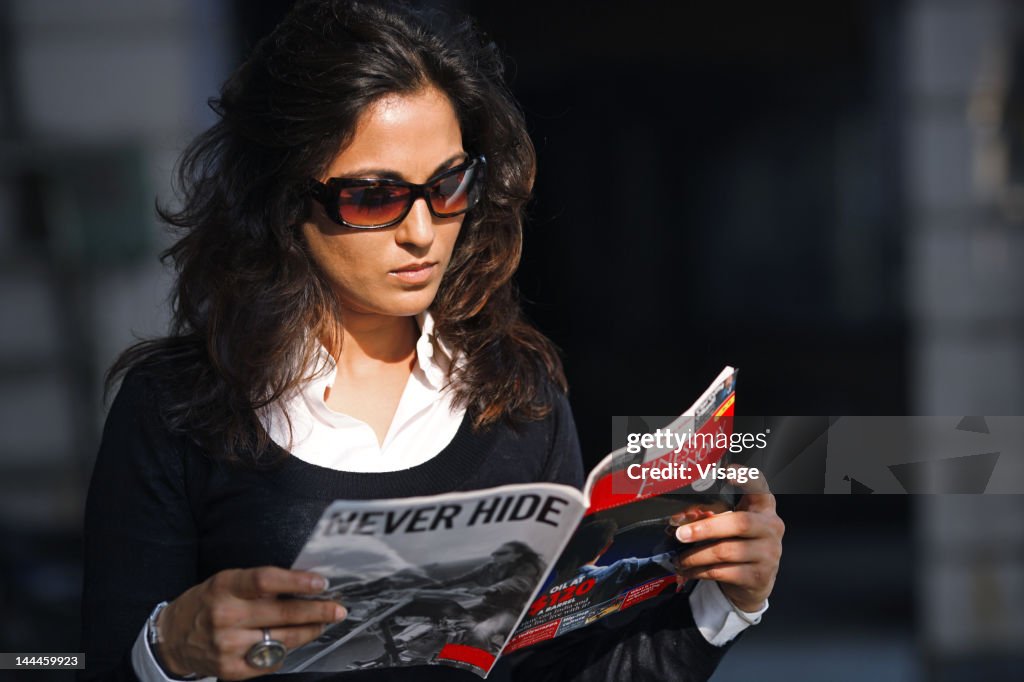 Woman reading a magazine