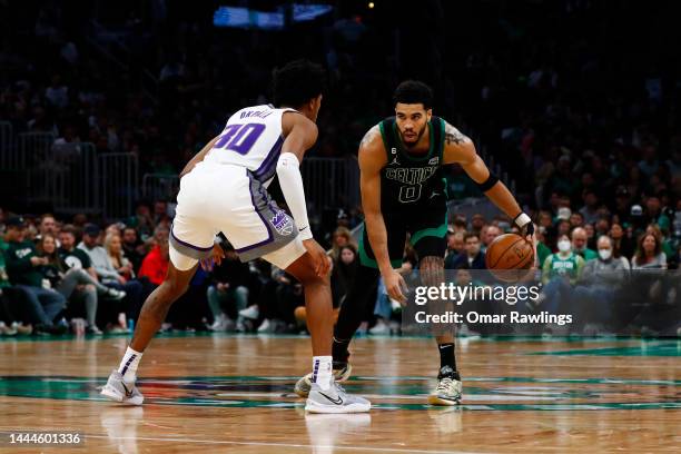 Jayson Tatum of the Boston Celtics brings the ball up court during the fourth quarter of the game against the Sacramento Kings at TD Garden on...