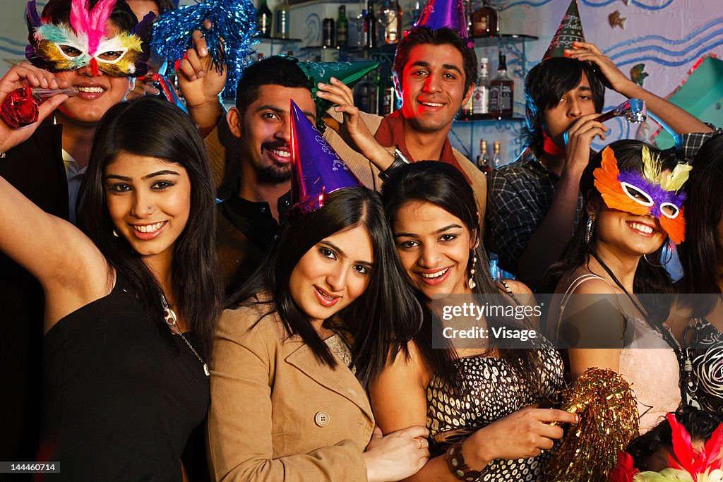 Portrait of youngsters celebrating at a party