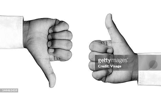 man hand showing thumbs up and thumbs down - daumen runter stock-fotos und bilder