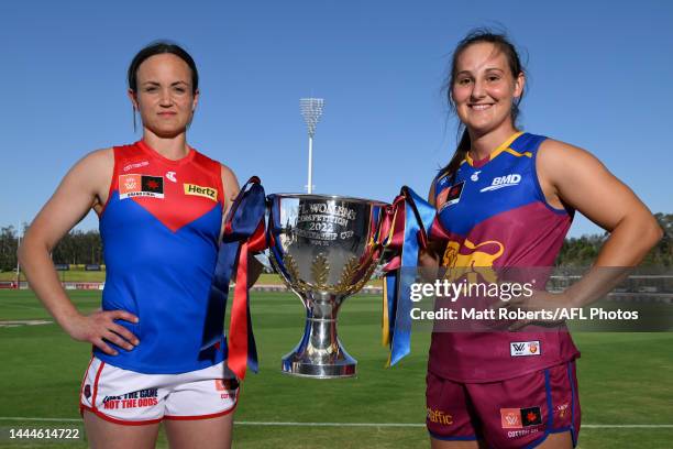 Daisy Pearce of the Demons and Breanna Koenen of the Lions pose with the trophy after a press conference ahead of the AFLW Grand Final between the...