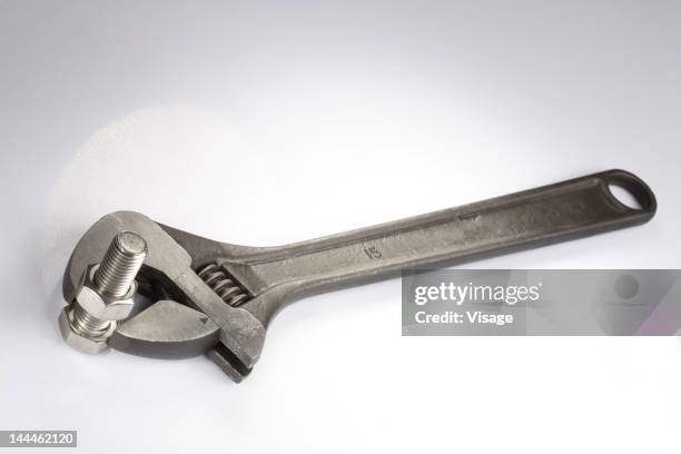 nut, bolt and adjustable spanner - screw simple machine stock pictures, royalty-free photos & images