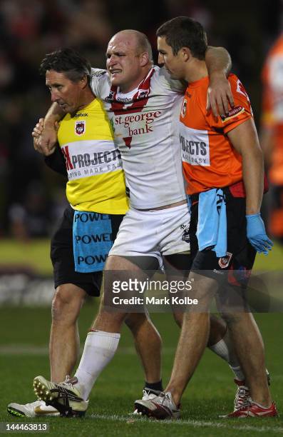 Michael Weyman of the Dragons is helped from the field with an injury during the round 10 NRL match between the Penrith Panthers and the St George...