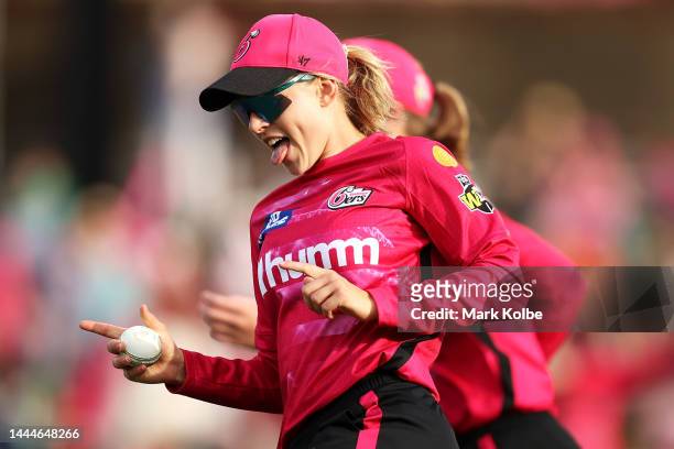 Maitlan Brown of the Sixers celebrates with her team after taking the catch for the wicket of Deandra Dottin of the Strikers only to have it...