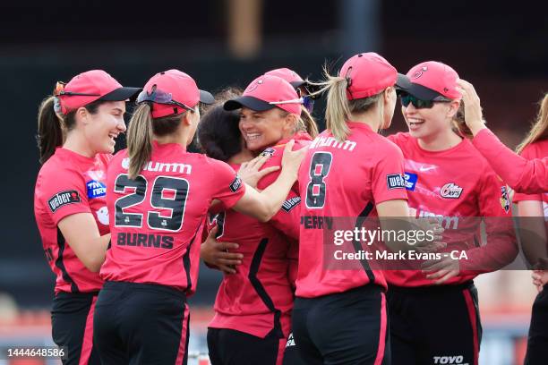 The Sixers celebrate the wicket of Tahlia McGrath during the Women's Big Bash League Final between the Sydney Sixers and the Adelaide Strikers at...