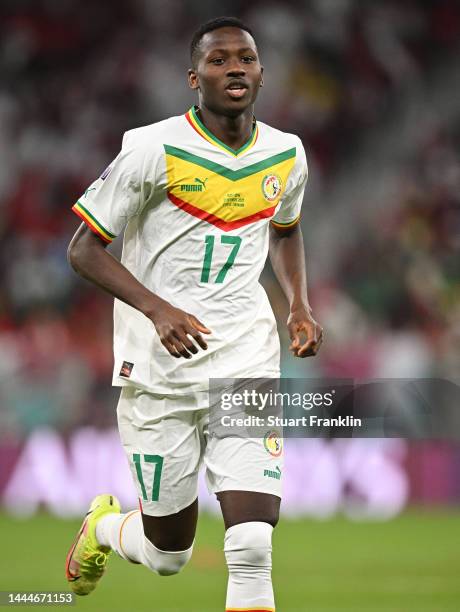 Pape Matar Sarr of Senegal in action during the FIFA World Cup Qatar 2022 Group A match between Qatar and Senegal at Al Thumama Stadium on November...