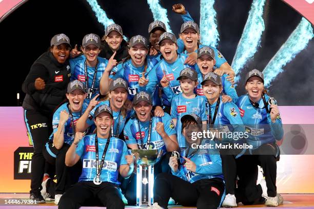 The Strikers celebrate with the trophy after victory during the Women's Big Bash League Final between the Sydney Sixers and the Adelaide Strikers at...