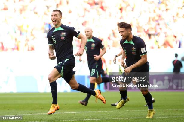 Mitchell Duke of Australia celebrates after scoring their team's first goal during the FIFA World Cup Qatar 2022 Group D match between Tunisia and...
