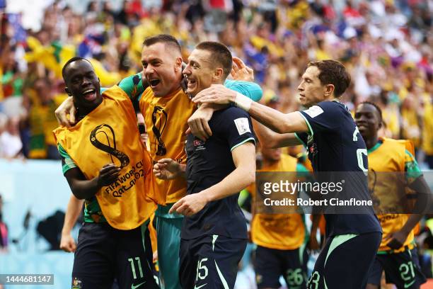 Mitchell Duke of Australia celebrates with teammates after scoring their team's first goal during the FIFA World Cup Qatar 2022 Group D match between...