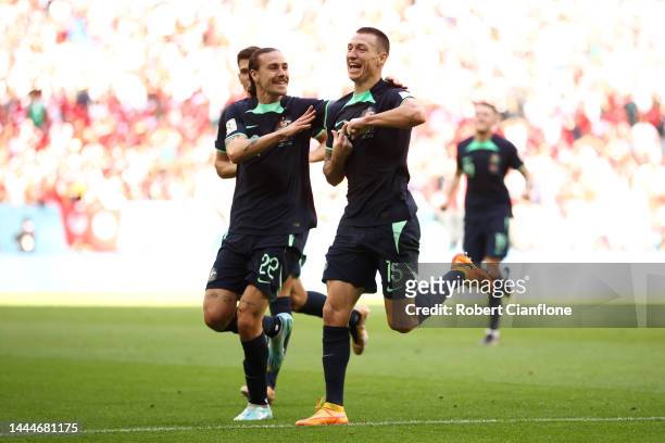 Mitchell Duke of Australia celebrates after scoring their team's first goal with their teammates Jackson Irvine during the FIFA World Cup Qatar 2022...