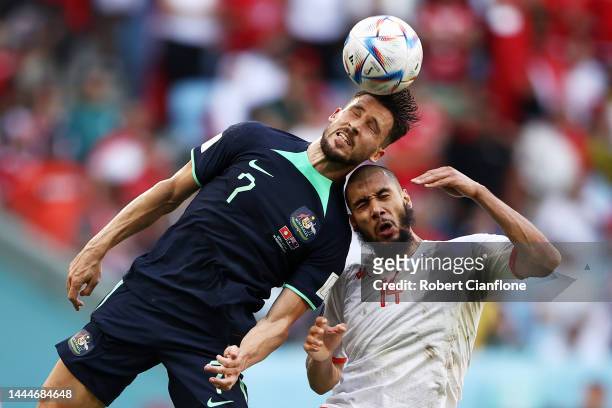 Mathew Leckie of Australia competes for a header against Aissa Laidouni of Tunisia during the FIFA World Cup Qatar 2022 Group D match between Tunisia...