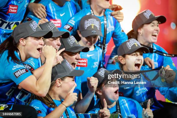 The Strikers celebrate with the trophy after victory during the Women's Big Bash League Final between the Sydney Sixers and the Adelaide Strikers at...