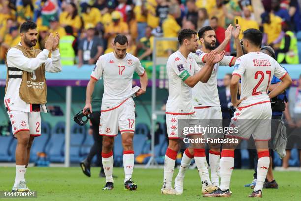 Dejected Tunisia players applaud the fans following the 1-0 defeat in the FIFA World Cup Qatar 2022 Group D match between Tunisia and Australia at Al...