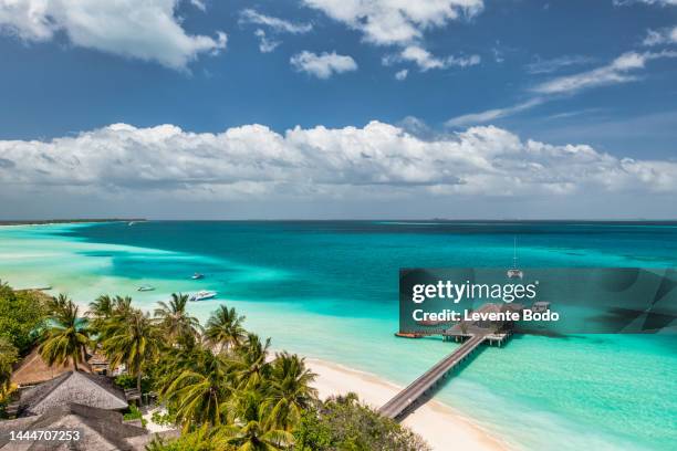 maldives paradise island. tropical aerial landscape, seascape with pier, water bungalows villas with amazing sea lagoon beach. exotic tourism destination, summer vacation background. aerial travel - malediven stockfoto's en -beelden