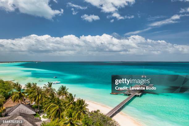 maldives paradise island. tropical aerial landscape, seascape with pier, water bungalows villas with amazing sea lagoon beach. exotic tourism destination, summer vacation background. aerial travel - maldives stock pictures, royalty-free photos & images