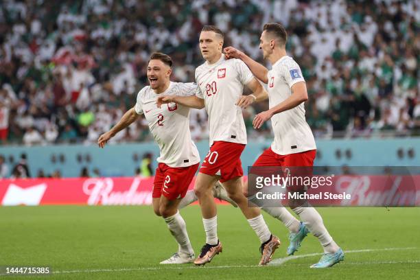 Piotr Zielinski of Poland celebrates after scoring their team's first goal during the FIFA World Cup Qatar 2022 Group C match between Poland and...
