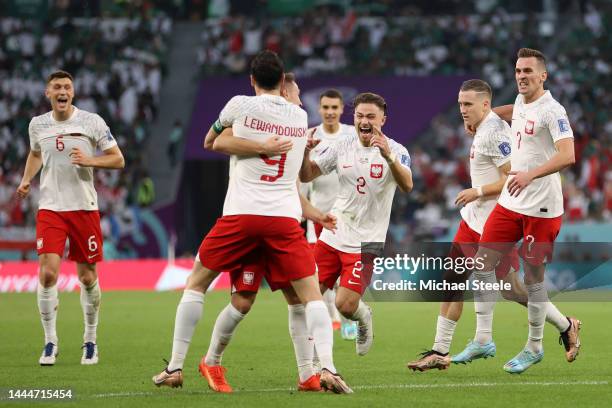 Piotr Zielinski of Poland celebrates with teammates after scoring their team's first goal during the FIFA World Cup Qatar 2022 Group C match between...