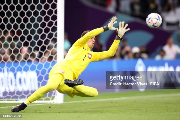Wojciech Szczesny of Poland make a save the shot by Mohammed Alburayk of Saudi Arabia after the penalty kick during the FIFA World Cup Qatar 2022...